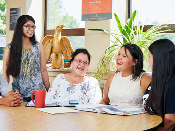 staff and students laughing together