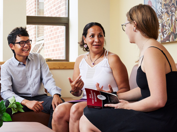 students and faculty conversing