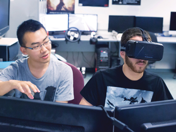 students in computer lab wearing vr headset