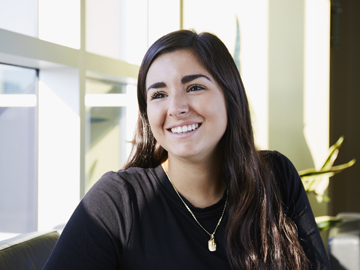 student sitting and smiling