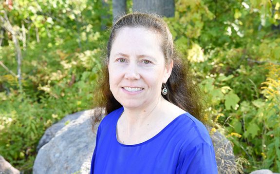staff sitting in forest