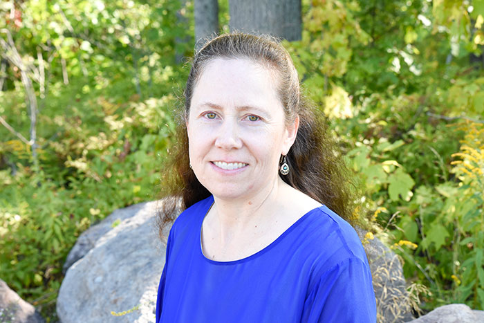 staff sitting in forest