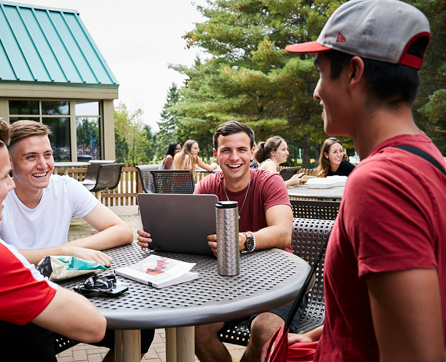 students talking outside