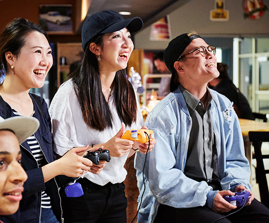 students playing video games in student lounge