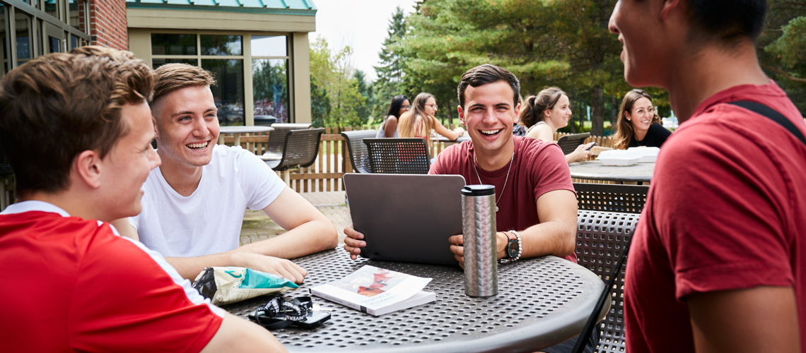 students talking outside