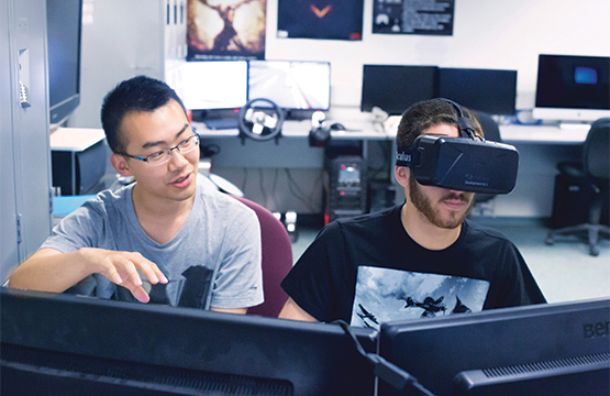 computer science students using virtual reality goggles
