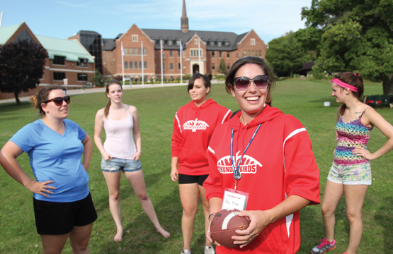student playing games in the front lawn of Shingwauk hall