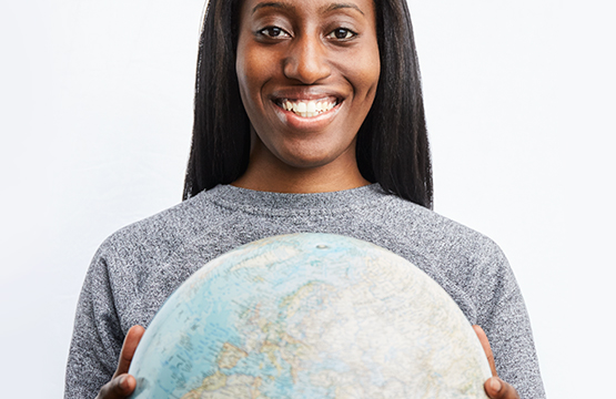 student holding globe