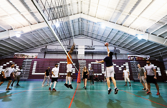 students playing volleyball