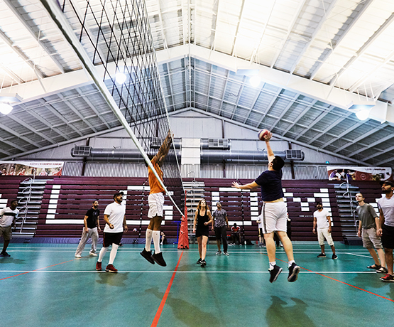 students playing volleyball