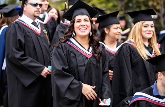 student in regalia during convocation