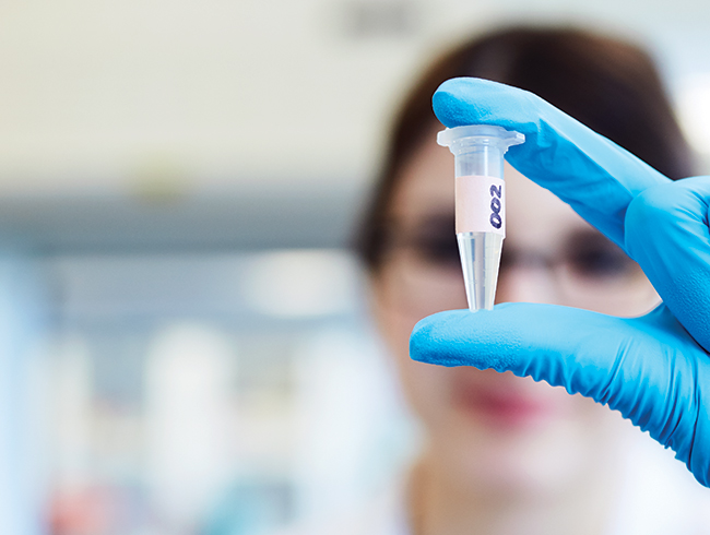 student headshot doing lab tests
