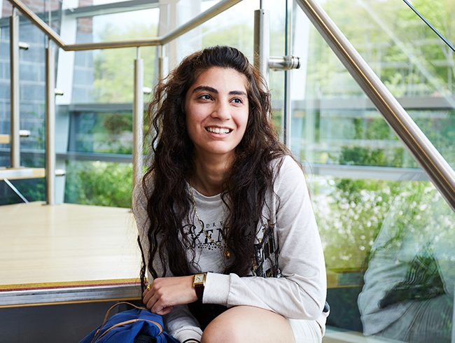 student sitting on steps