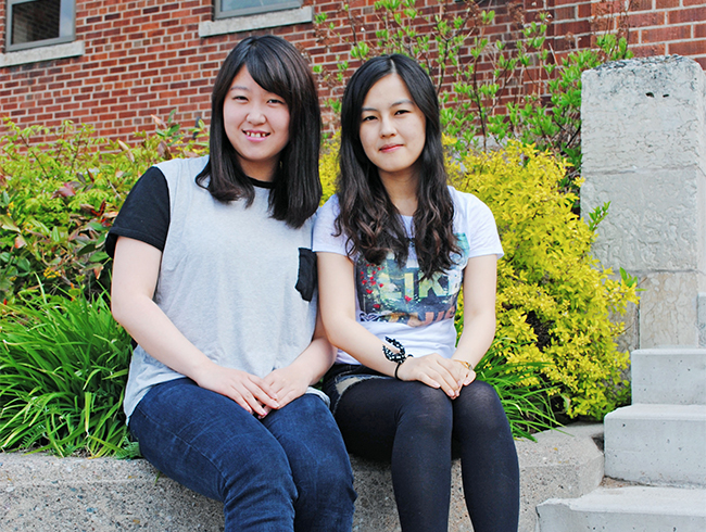 students sitting outside