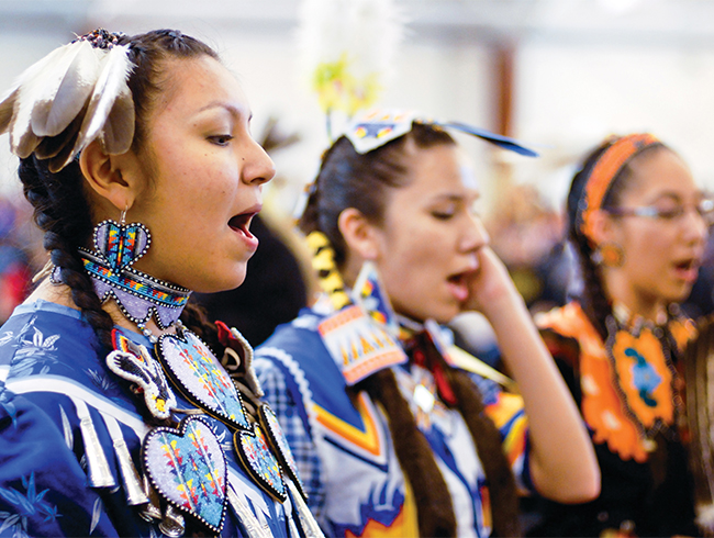 anishinaabe students in traditional garments