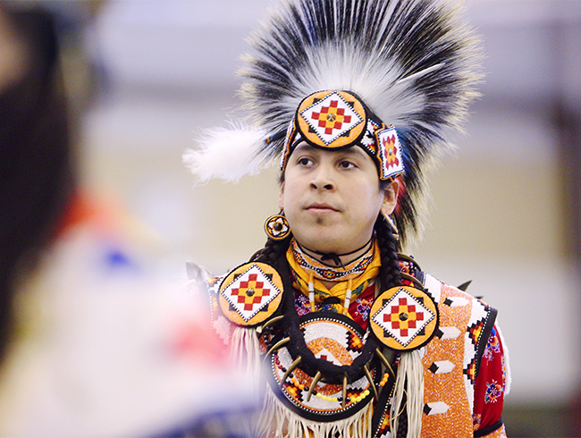 anishinaabe student in traditional garments