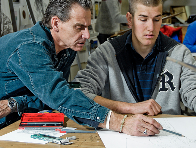 student and professor in art studio
