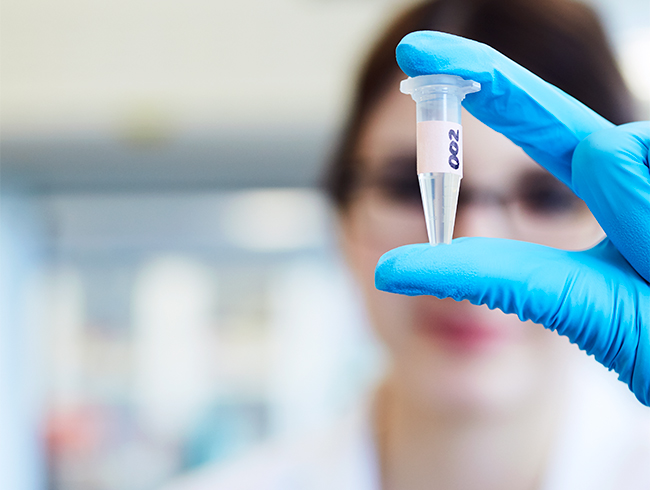 student holding test tube