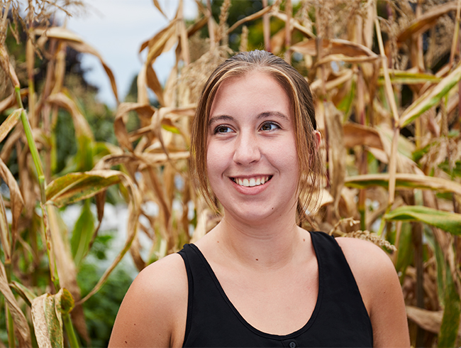 student in cornfield