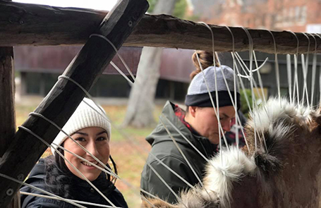 students learning how to transform deer hide