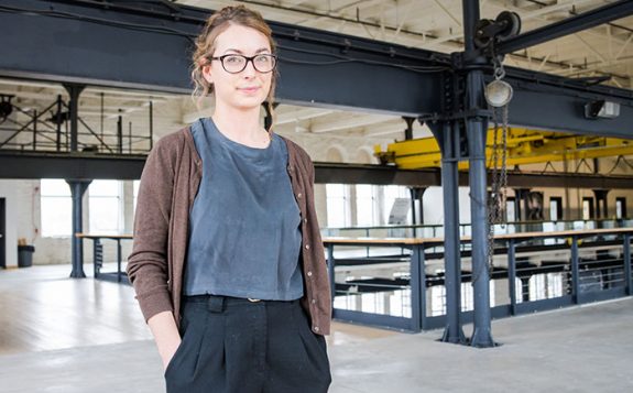 student standing in industrial site