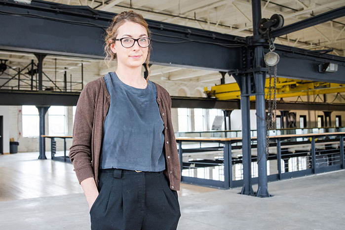 student standing in industrial site