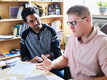 student and professor talking
