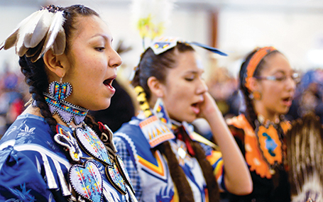 anishinaabe students in traditional Anishinaabe regalia