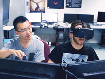 students in computer lab wearing vr headset
