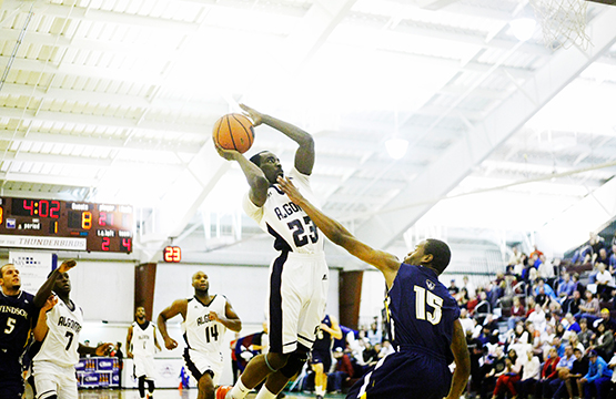student playing basketball