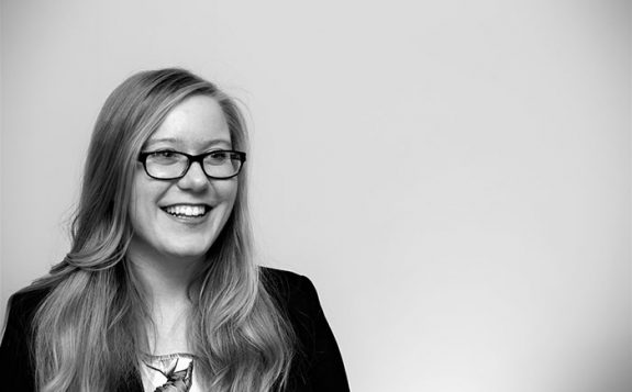 black and white photograph of student smiling