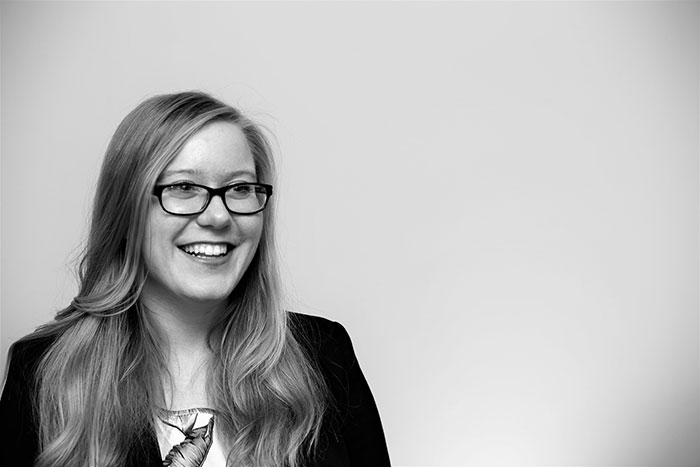 black and white photograph of student smiling