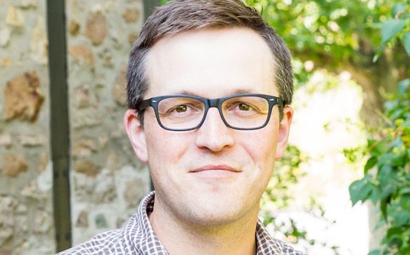 faculty member smiling