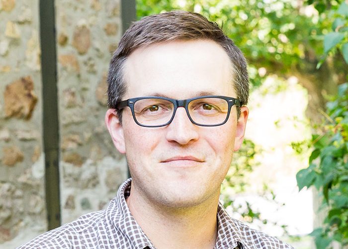 faculty member smiling