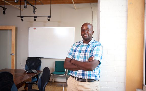 man standing in board room