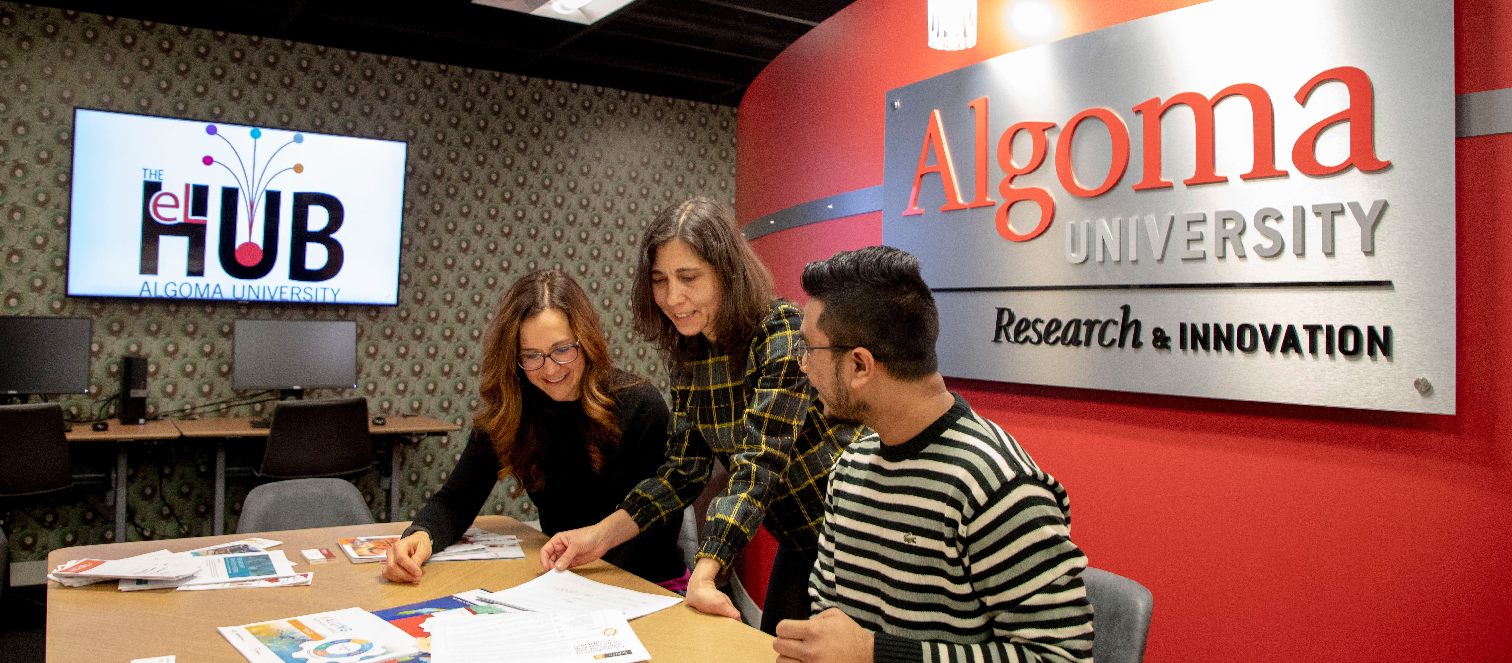 students and faculty collaborating in experiential learning hub