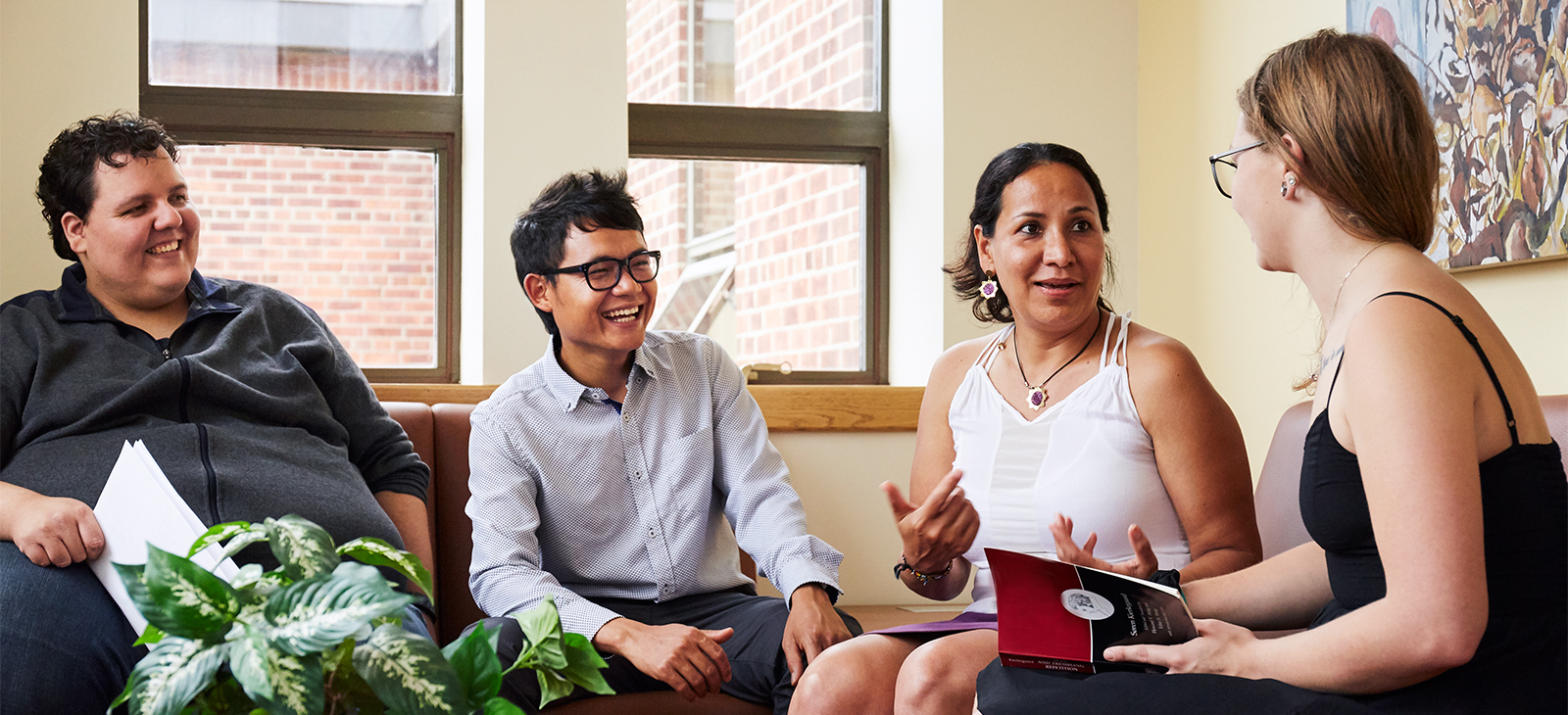 students and faculty sitting and talking