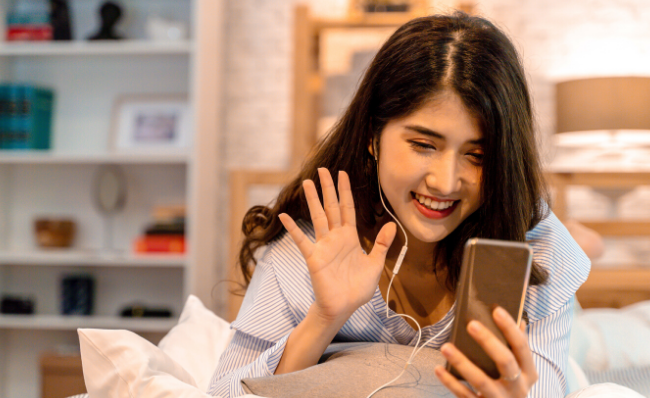Student joining a virtual event on her smartphone