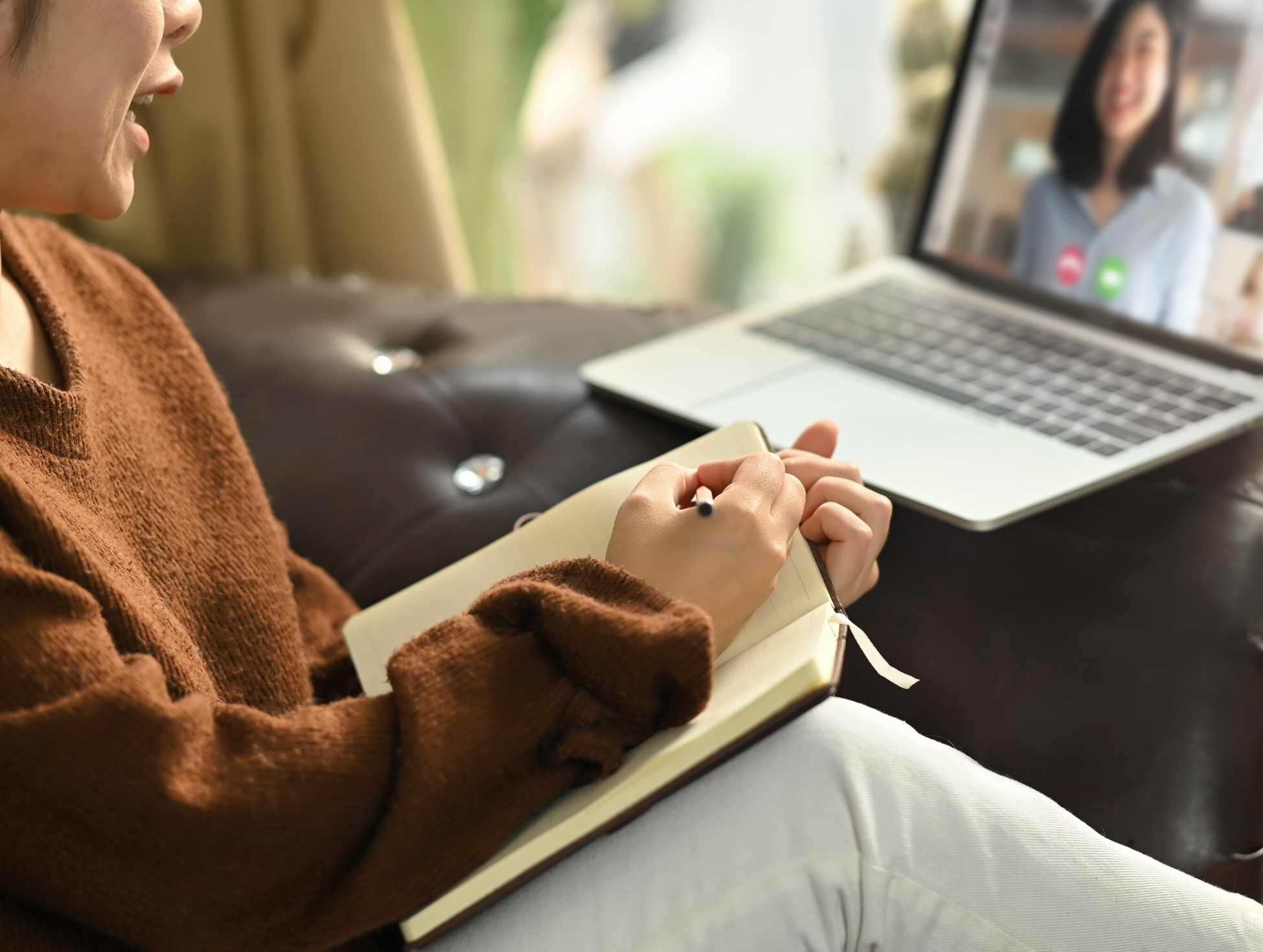 student joining a virtual meeting and taking notes