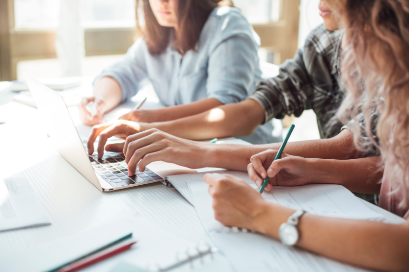 students typing and writing