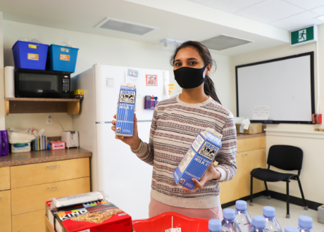 student holding milk