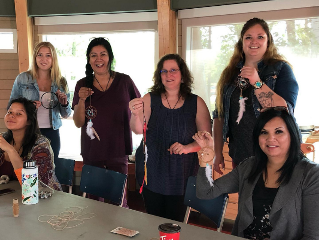 student making dream catchers