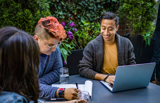 Students collaborating at table