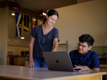 Students collaborating on laptop