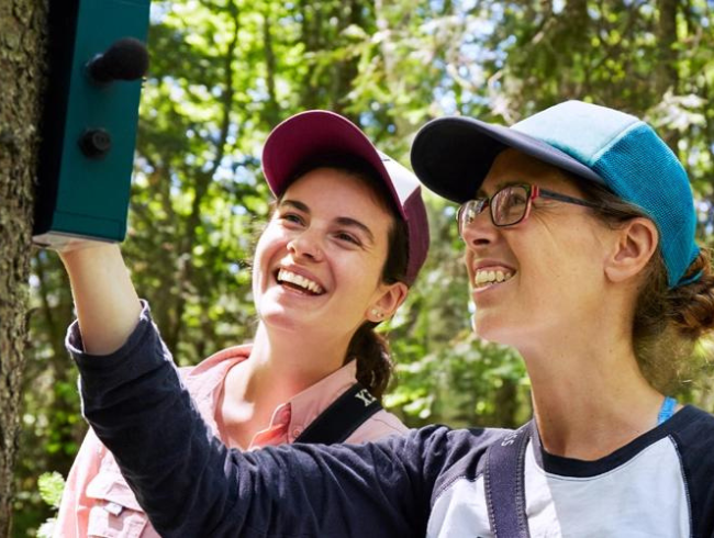 student and professor in the field