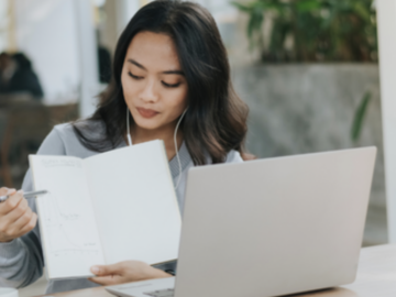 student on computer presenting
