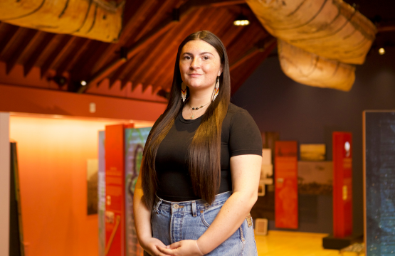 Algoma U student, Manon standing in the Shingwauk Residential School Museum